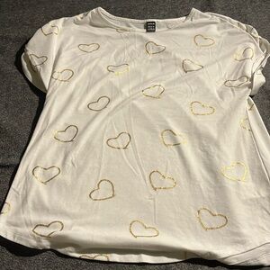 A white shirt with hearts